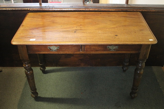 Appraisal: A LATE VICTORIAN MAHOGANY TWO DRAWER SIDE TABLE with ring