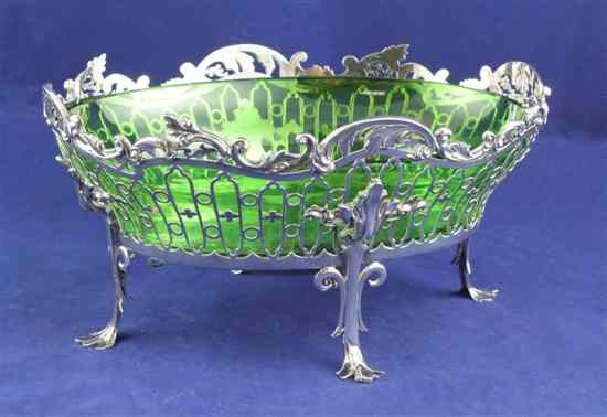 Appraisal: An Edwardian pierced silver oval fruit bowl with scrolling foliate