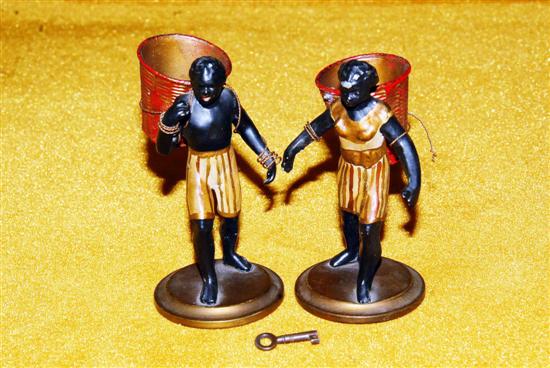 Appraisal: PAIR METAL BLACKAMOOR FIGURES Carrying baskets H each