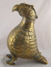 Appraisal: A cast brass container in the form of a bird