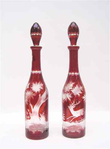 Appraisal: PAIR BOHEMIAN GLASS DECANTERS cut and etched red to clear