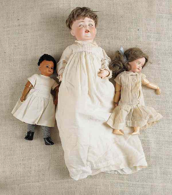 Appraisal: Three bisque dolls two marked Armand Marsaille the other marked