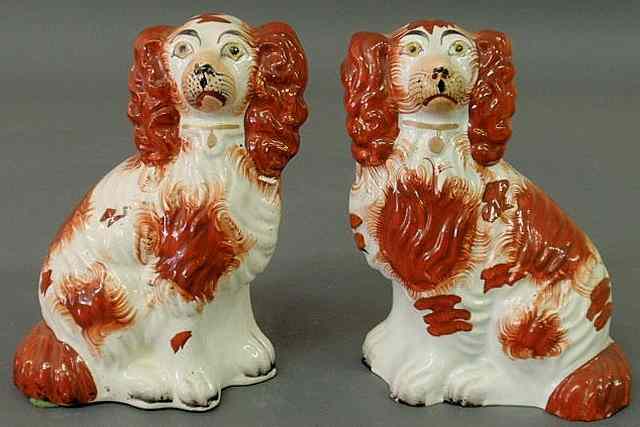 Appraisal: Pair of th c Staffordshire seated red and white spaniels