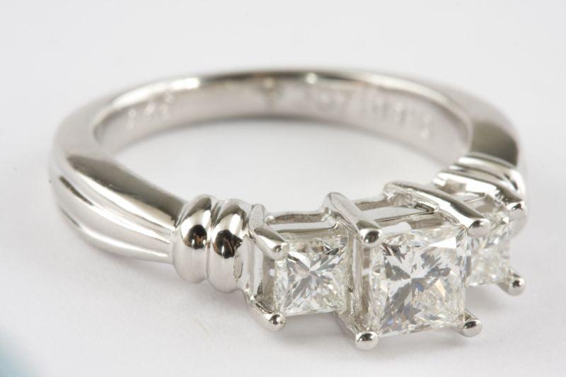 Appraisal: Platinum Three Stone Diamond Ring with half round shank prong