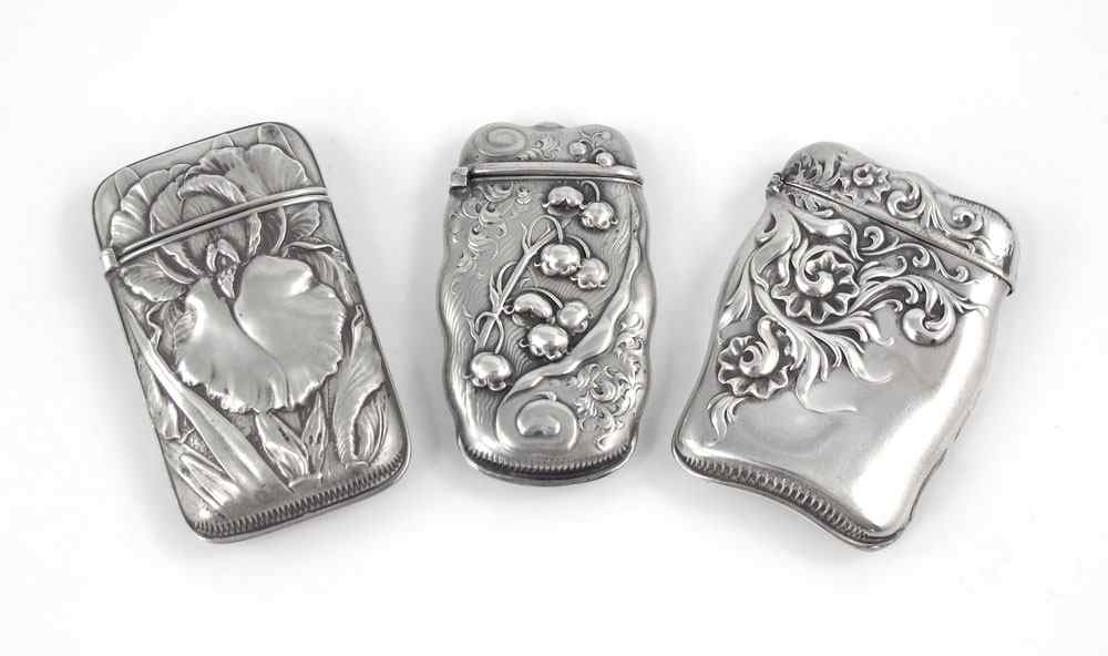 Appraisal: WHITING ART NOUVEAU FLORAL STERLING MATCH SAFES All with art