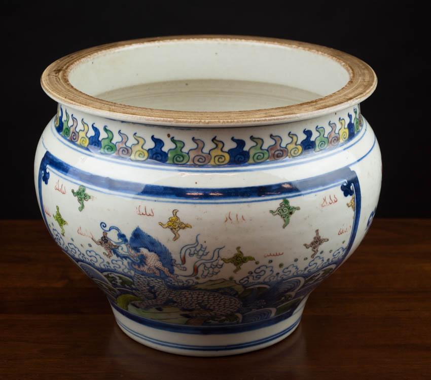 Appraisal: CHINESE WUCAI PORCELAIN JARDINIERE with hand enameled cartouches of dragons