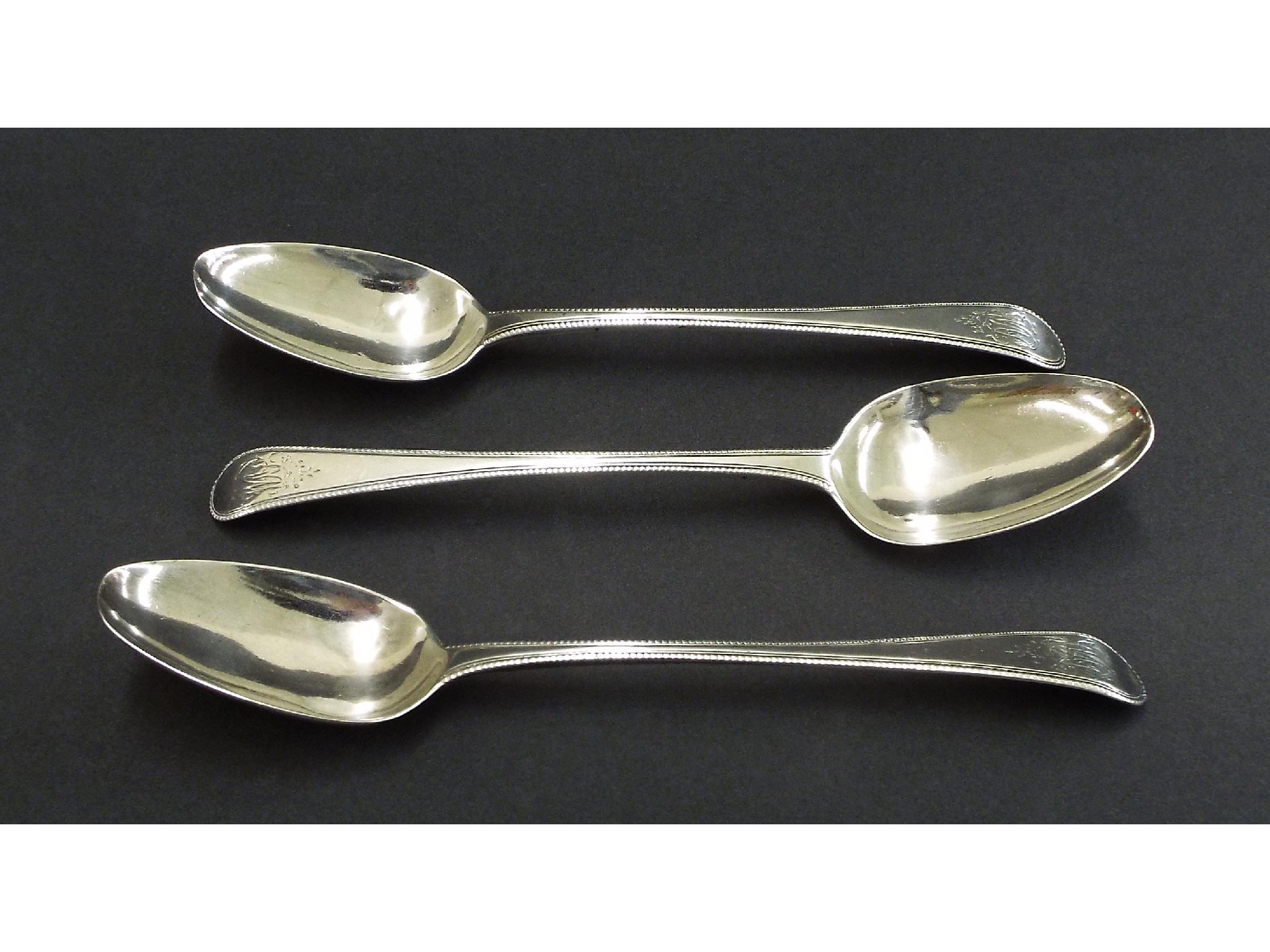 Appraisal: Set of three George III silver Old English table spoons