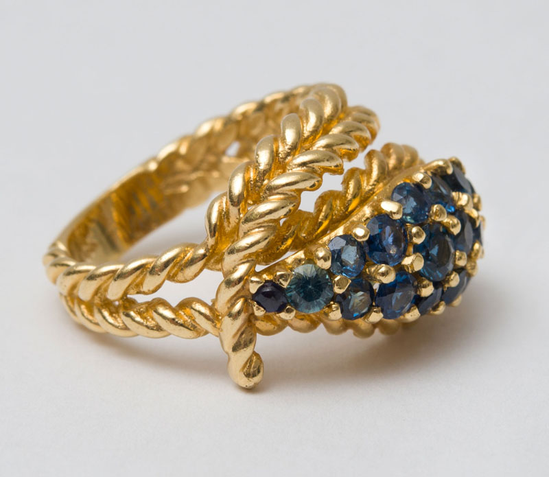 Appraisal: K GOLD AND SAPPHIRE COCKTAIL RING Set with round cut