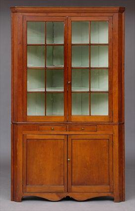 Appraisal: NEW ENGLAND FEDERAL CHERRY SINGLE-PIECE CORNER CABINET The molded cornice