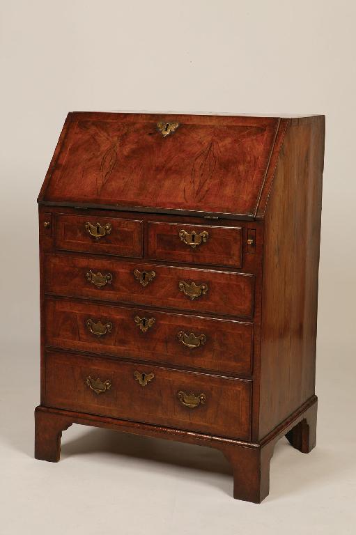 Appraisal: A GEORGE I WALNUT BUREAU the rectangular top with feathered