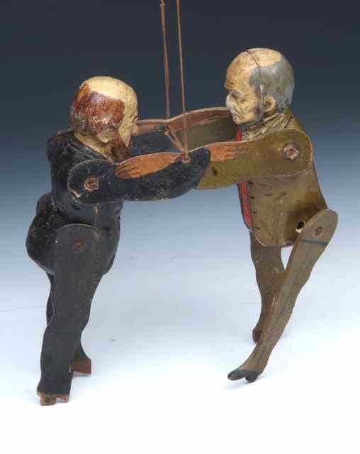 Appraisal: A VICTORIAN MARIONETTE of Gladstone and Disraeli wresting each composite