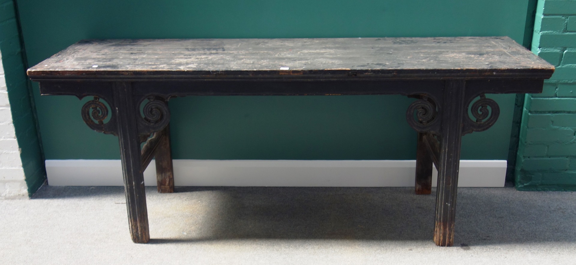 Appraisal: A late th century Chinese ebonised altar table on block