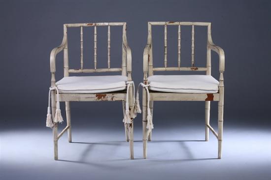 Appraisal: PAIR REGENCY STYLE PAINTED OPEN-ARM FANCY CHAIRS th century with