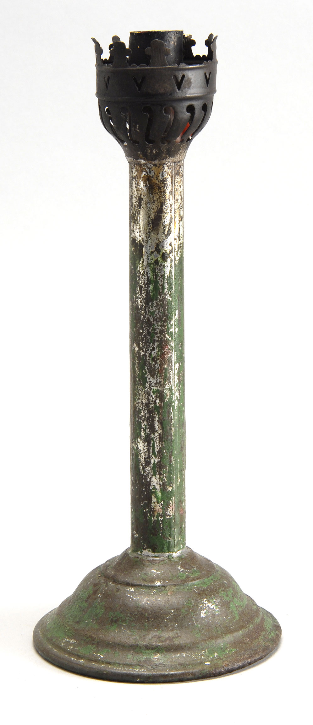 Appraisal: WEIGHTED TIN CANDLESTICK under green paint Cut and pierced design