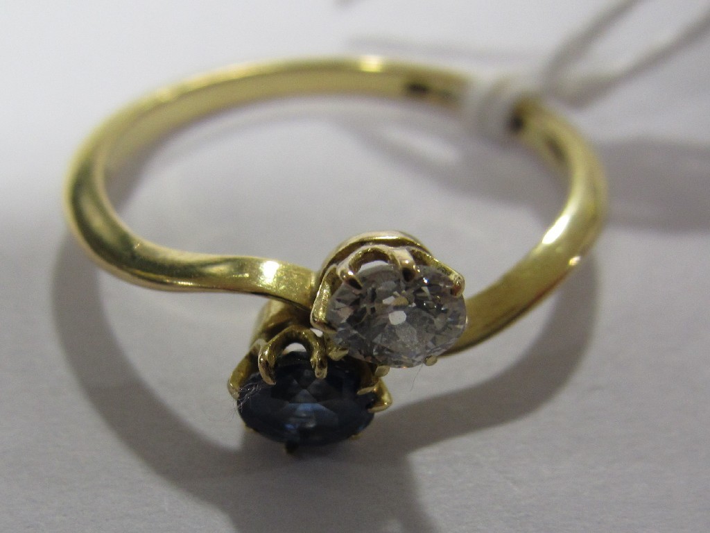 Appraisal: Eighteen carat gold sapphire and diamond two stone twist ring