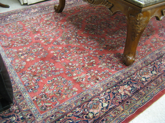 Appraisal: HAND KNOTTED ORIENTAL CARPET Indo-Sarouk overall floral design on red