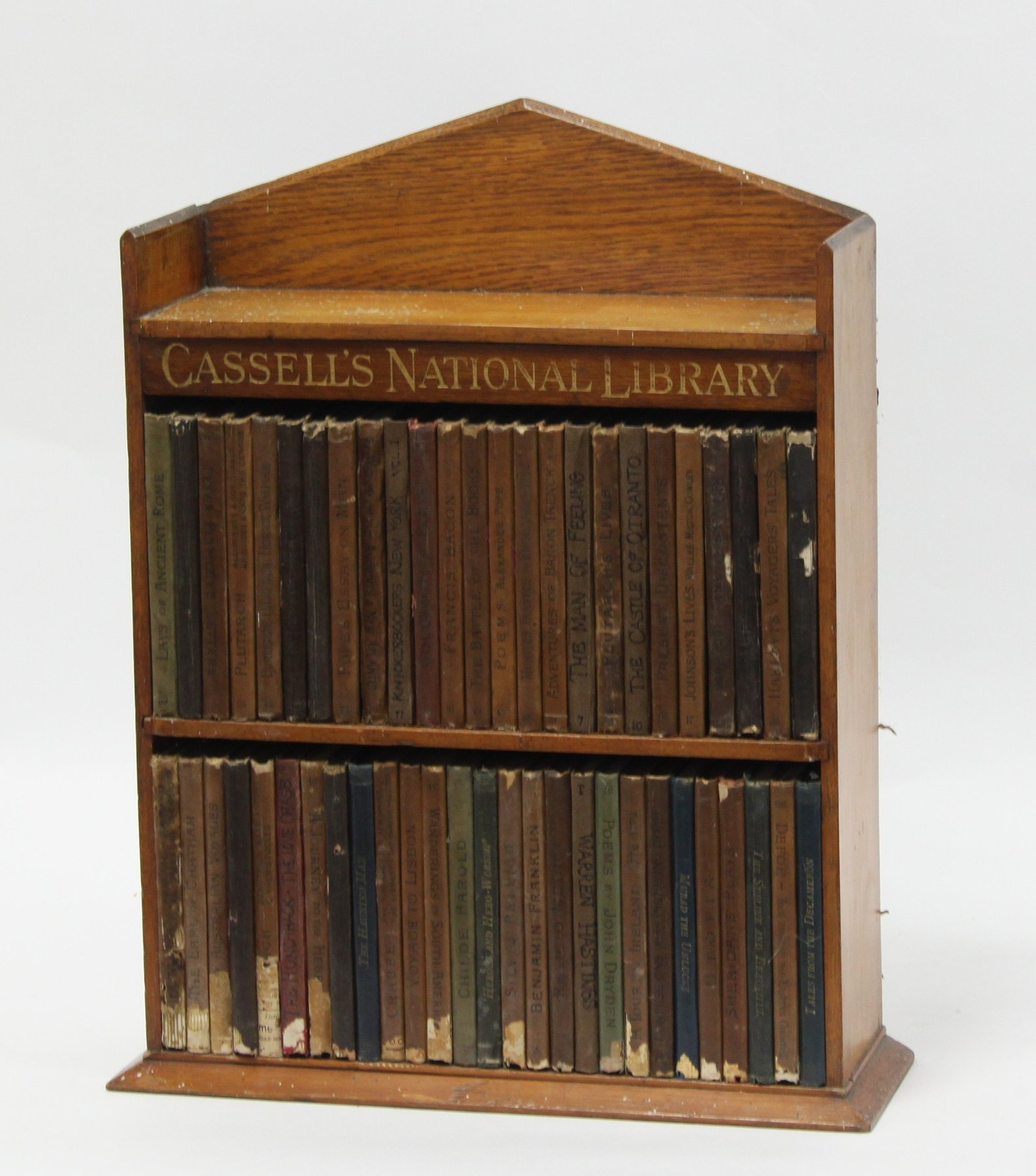 Appraisal: Cassells National Library volumes contained in an oak bookcase