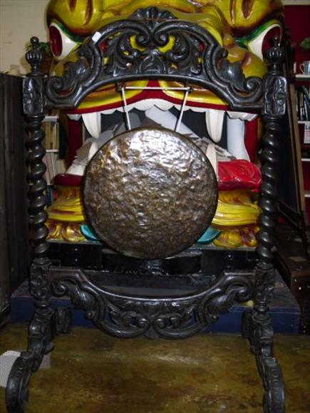 Appraisal: A carved oak dinner gong