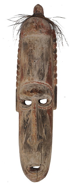 Appraisal: A CARVED WOODEN AFRICAN TRIBAL MASK with polychrome decoration and