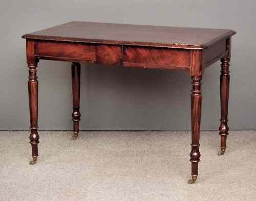 Appraisal: A Victorian mahogany rectangular library table the top with moulded