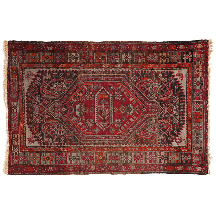 Appraisal: Persian rug c stylized floral design on a red field