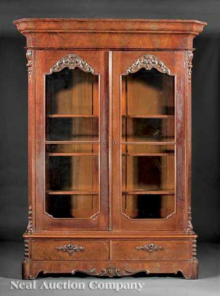 Appraisal: An American Rococo Carved Mahogany Bookcase mid- th c flared