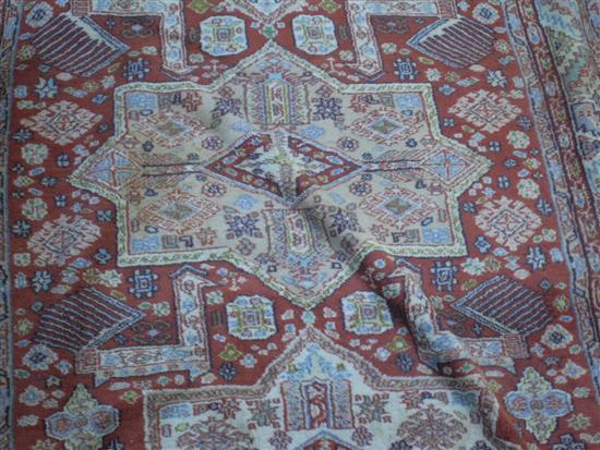 Appraisal: Persian cream ground rug with multiple borders the centre with