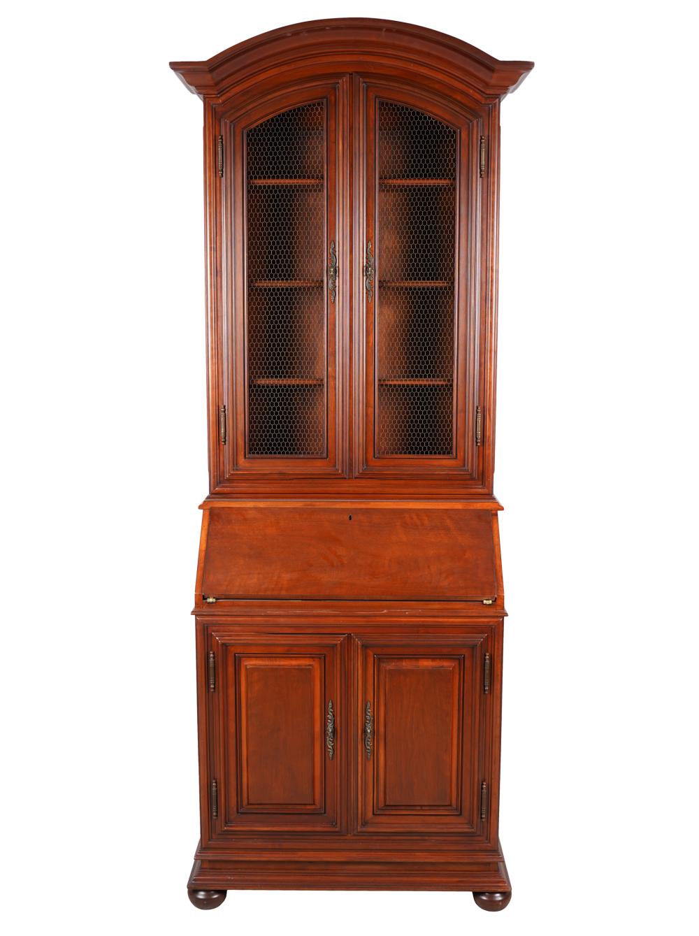 Appraisal: WALNUT SECRETARY BOOKCASElate th century with mesh-inset doors over a