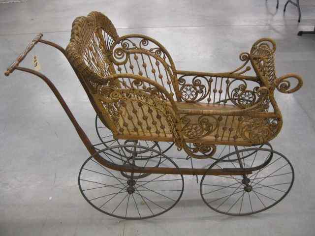 Appraisal: Wakefield Natural Wicker Baby Carriage circa metal base fancy model