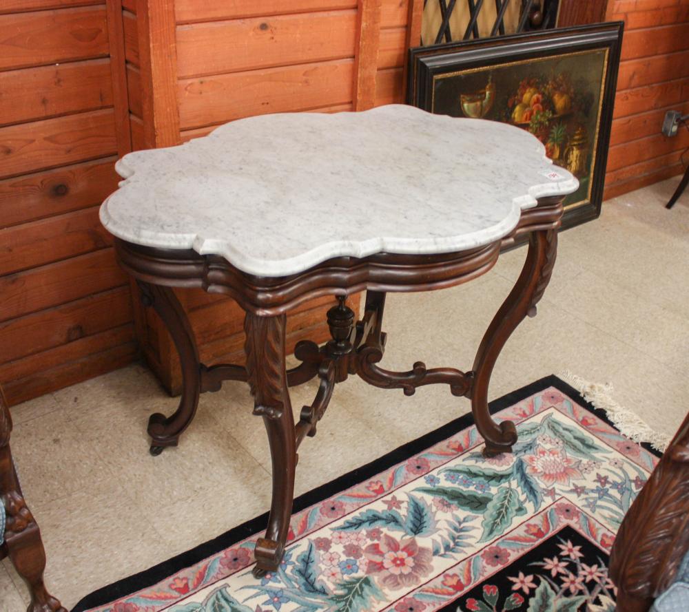 Appraisal: VICTORIAN MARBLE-TOP WALNUT CENTER TABLE Rococo design American late th