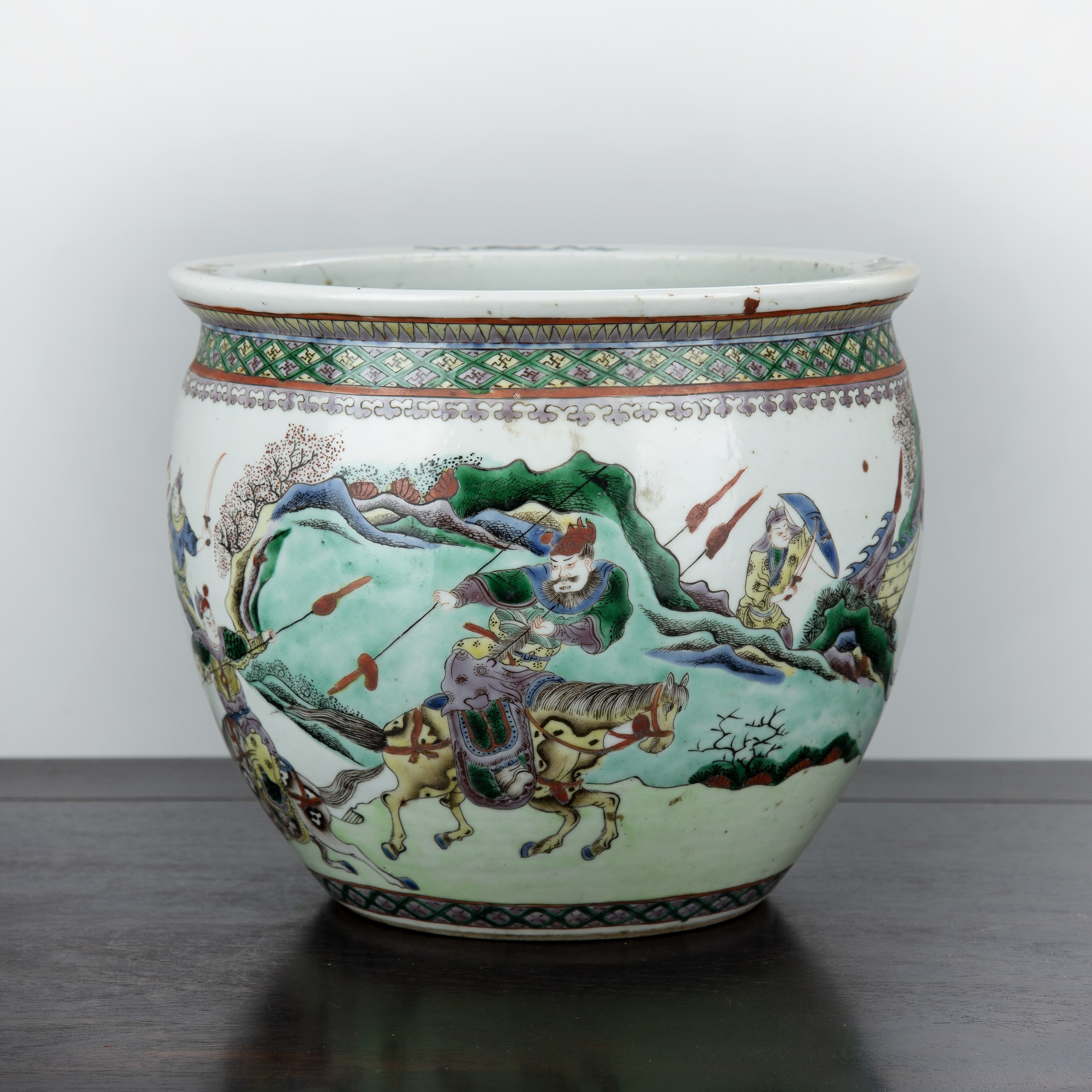 Appraisal: Famille verte jardiniere Chinese th Century depicting figures on horse