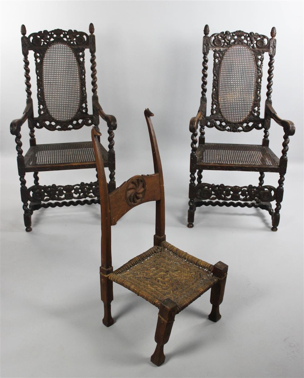 Appraisal: PAIR OF BAROQUE STYLE CARVED OAK AND CANED ARM CHAIRS