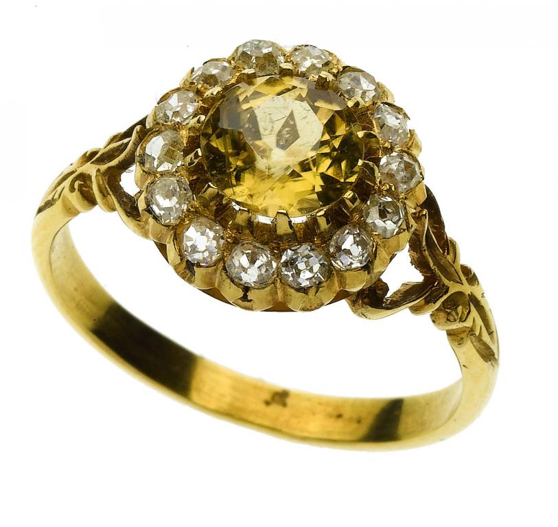 Appraisal: AN ANTIQUE CITRINE AND DIAMOND CLUSTER RING with pierced shoulders