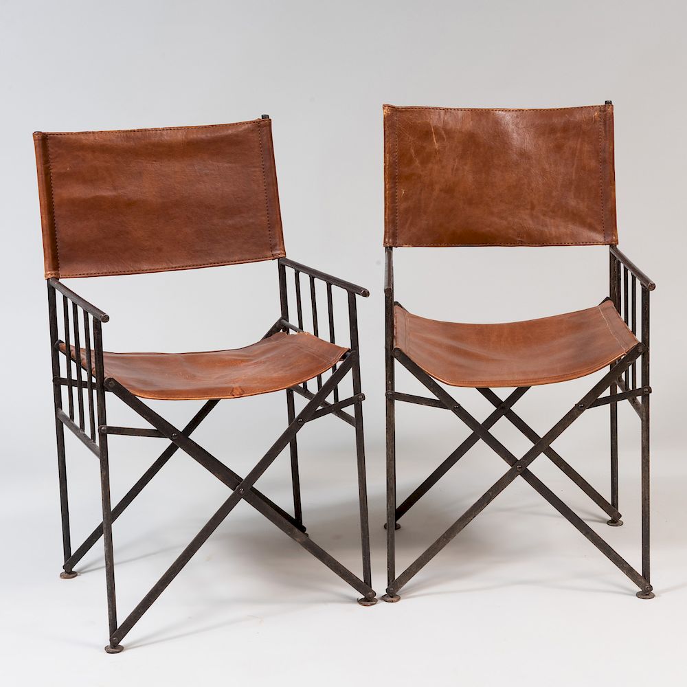 Appraisal: Pair of Continental Metal and Leather Campaign Armchairs x x