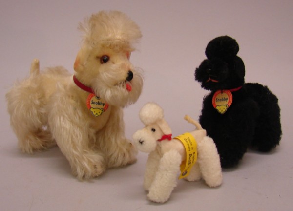 Appraisal: Lot of poodles White felt wool plush poodle with silver