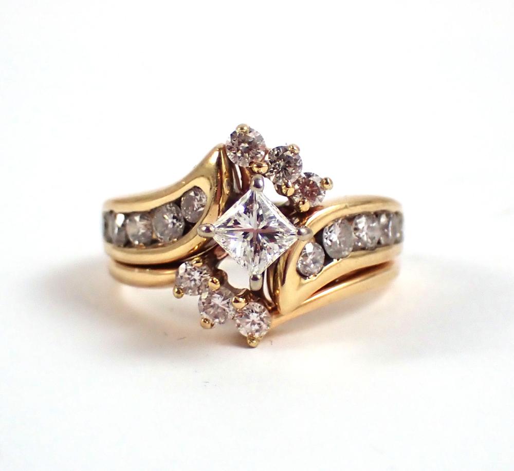 Appraisal: DIAMOND AND FOURTEEN KARAT GOLD RING with round brilliant-cut diamonds