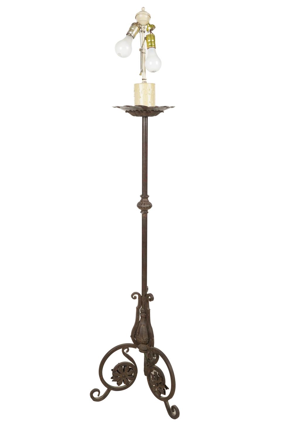 Appraisal: SPANISH REVIVAL WROUGHT-IRON FLOOR LAMPwith faux candle issuing three sockets