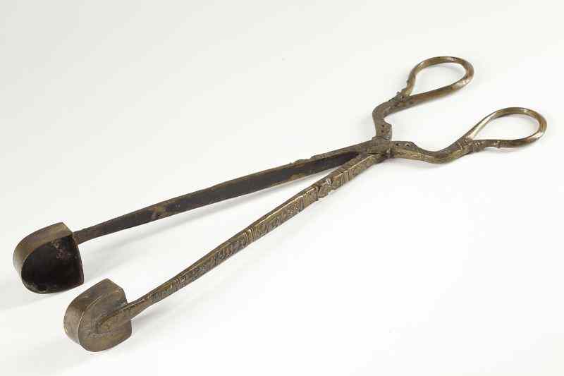 Appraisal: Egyptian Candle Snuffer th century metal with chased calligraphy and