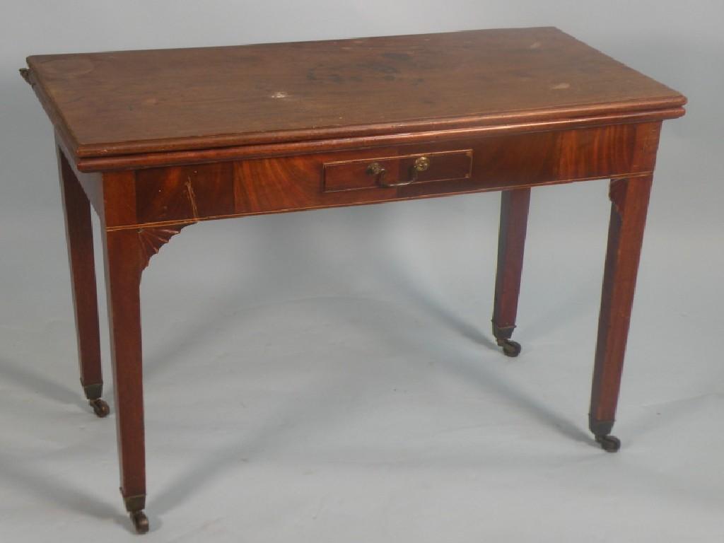 Appraisal: A thC mahogany tea table with a frieze drawer on