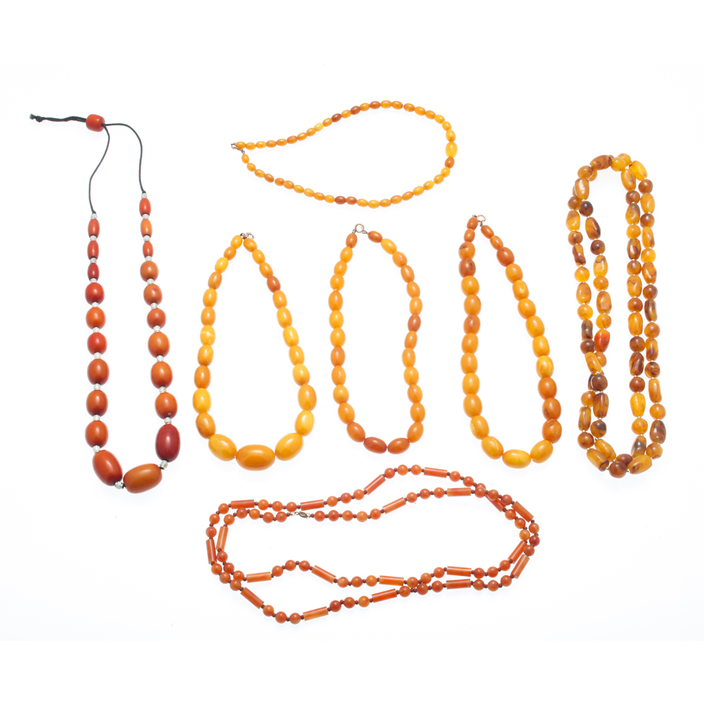 Appraisal: Two amber bead necklaces each composed of a double row