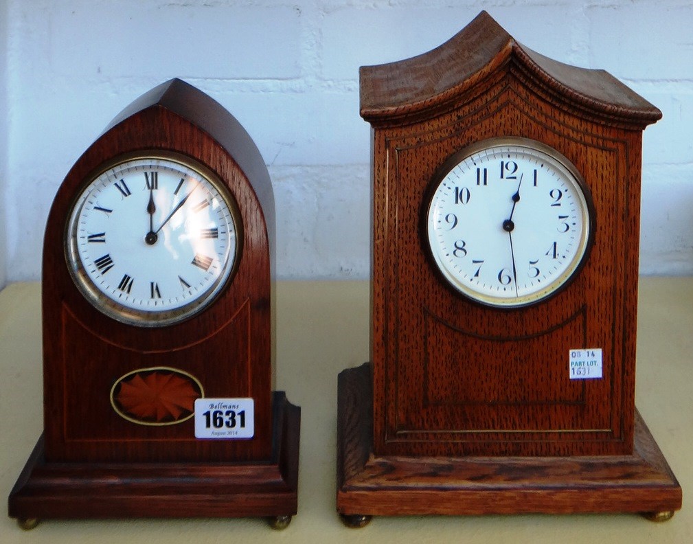 Appraisal: An Edwardian cased mantel clock the arched case with white