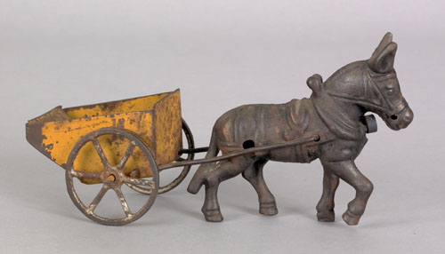 Appraisal: Cast iron donkey cart toy early th c l