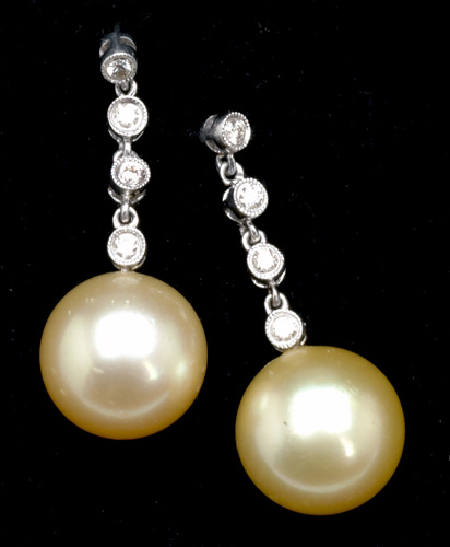 Appraisal: Golden South Sea pearl and diamond earrings Each mm spherical