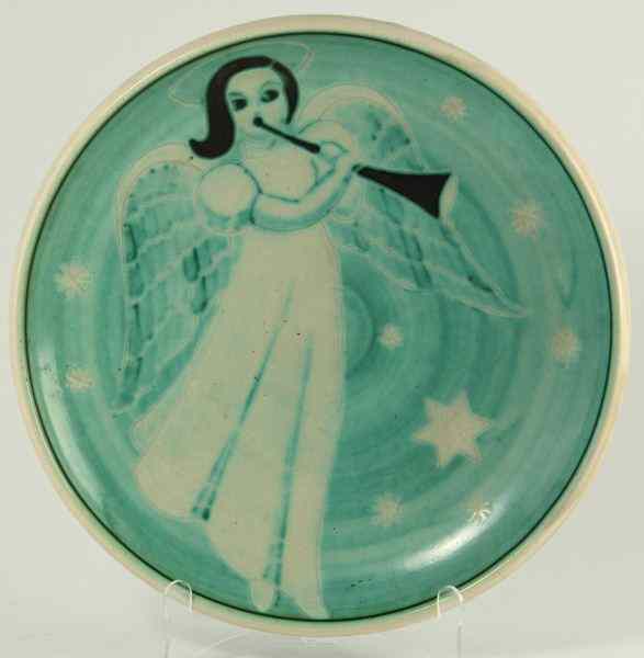 Appraisal: Finnish Art Pottery Chargerfeaturing a trumpeting angel on pale green