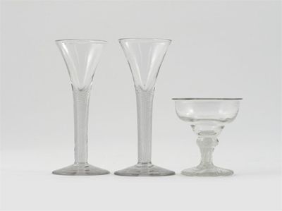 Appraisal: A pair of wine glasses with flared bowls raised on