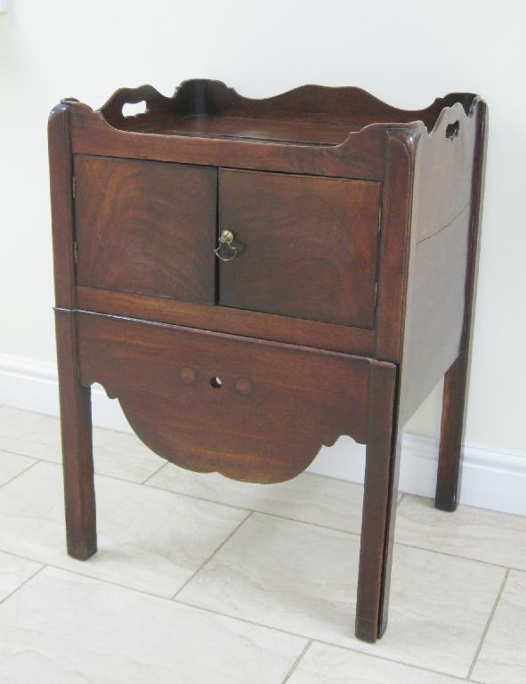 Appraisal: A George III mahogany tray top Commode with pierced hand