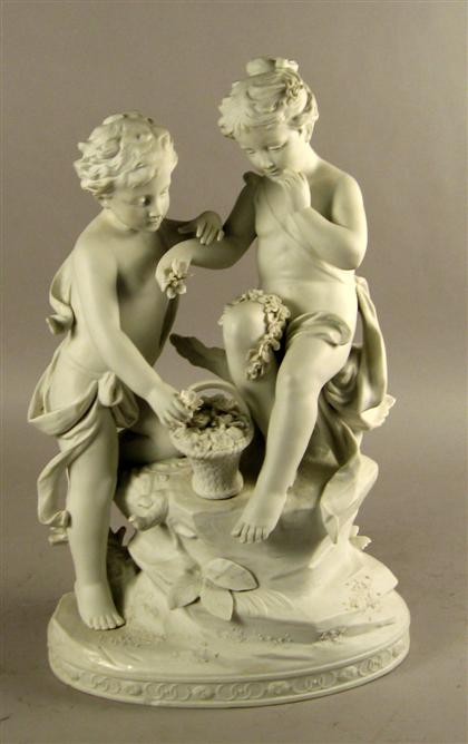 Appraisal: French bisque figure group Modeled as two two children seated