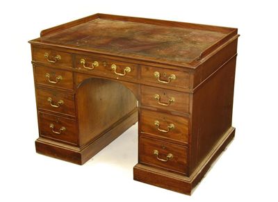 Appraisal: A George III mahogany kneehole desk the moulded edge top