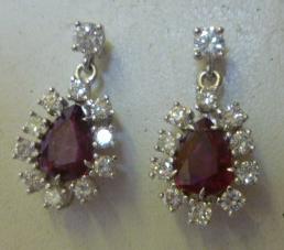 Appraisal: A PAIR OF RUBY AND DIAMOND DROP EARRINGS the pear