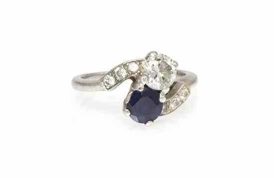 Appraisal: A Platinum Sapphire and Diamond Toi et Moi Ring containing